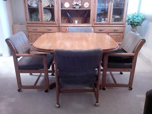 Wood dining room table with chairs