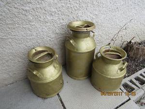 3 milk cans painted gold with lids