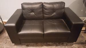 Couch and loveseat set. Black faux leather