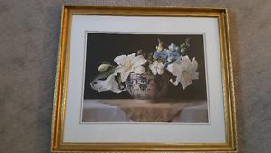 Large floral picture in gold frame.