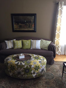 Nice couch, bright ottoman & cool print