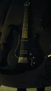 Nova electric guitar with a nova amp 100$..extra items to