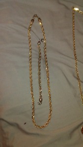 Silver and gold coloured chain and braclet.