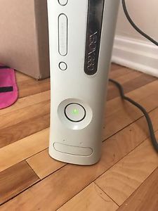 XBox 360 with 2 Wireless Controllers and 8 games.