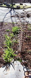 rusted metal abstract lawn sculpture