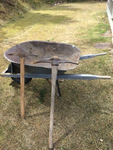 's steel wheel barrow, two "antique" pick axes