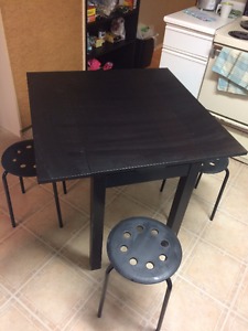 1-year-old, black Ikea table with 4 stools