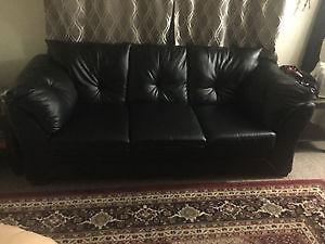 Black couch with love seat & coffee table