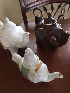 Three elephant teapots in mint condition, never used