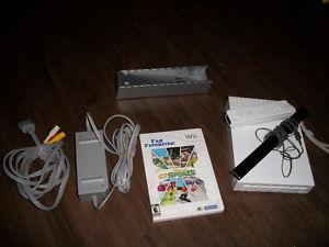 Wii Console & all chords, sensor, and a remote controller.