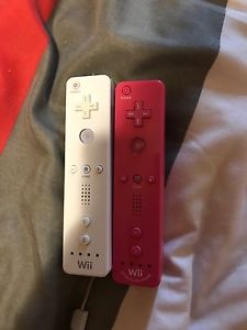 Nintendo Wii controllers pink and white