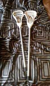 2 lacrosse sticks