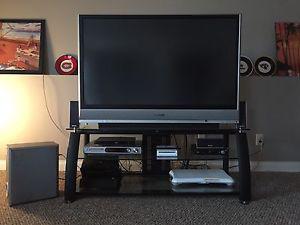 50' Panasonic projection TV, stand and surround sound