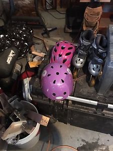 Child's roller blades and helmets.