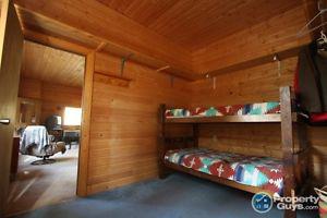 Solid wooden bunk beds with mattresses