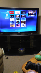 55 inch Phillips tv and nice stand