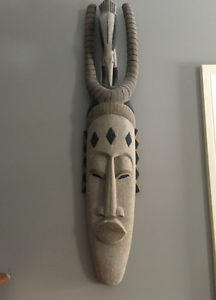 African wooden mask with a sand finish