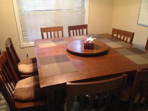 Dining table with eight chairs and lazy Susan