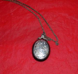 Sterling silver locket with beautiful scrolling on the front