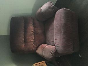 Two matching red recliners