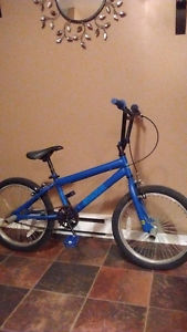 20" blue Huffy stunt bike