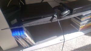 PS4 console with 1 controller and 5 games