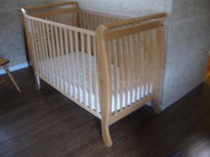 Wooden crib with mattress