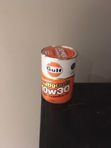 4 gulf oil cans