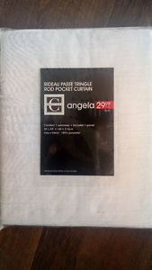 4 white curtain panels (Still in package)
