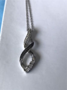 Infinity pendant with real diamonds