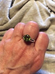 Silver ring with green stone size 7