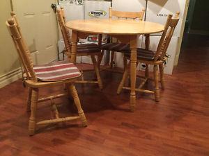 Solid yellow birch dinning table and four chairs for sale.