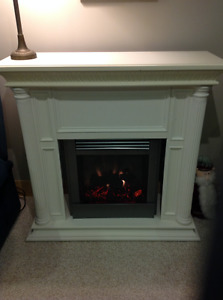 While fireplace with electric insert (working condition).