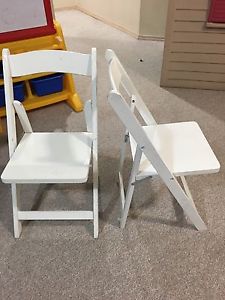 2 Kids white folds up wooden chairs