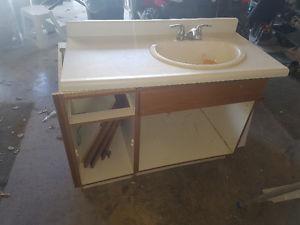 42 inch cabinet and countertop and toilet