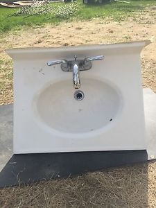 Bathroom sink and taps