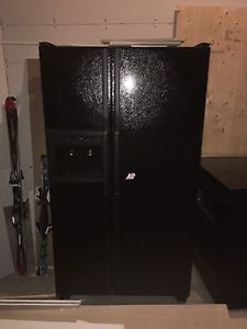 Black fridge, stove and dishwasher