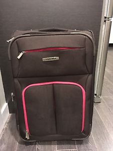 Brown and pink Tracker suitcase