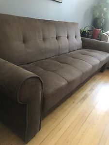 Brown couch with storage, folds down to daybed