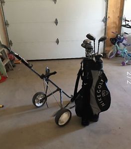 Woman's Golf clubs, cart and shoes