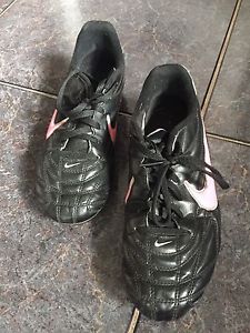 Black and pink Nike soccer cleats