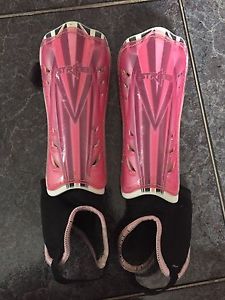 Pink and black youth soccer shin pads - size medium