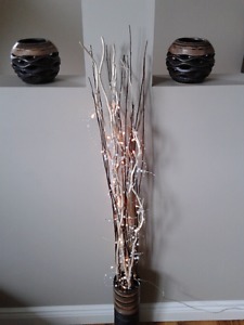 Lit branches and twigs with matching candle holders