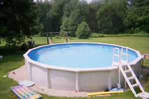 High end 27 ft round above ground pool with heater,