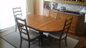 Solid oak dining table and 4 chairs