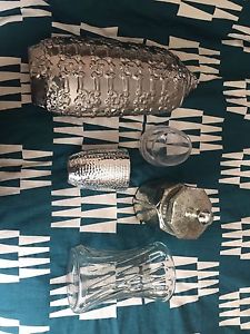 Various sizes of clear and silver jars/vases