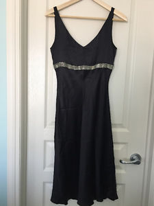 Black 100% silk dress with silver beading. Size 6