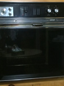 Black counter top stove and wall mount oven