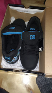 Brand new DC black an blue sneakers