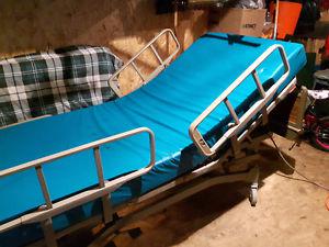 Hospital bed with mattress 250$ obo.